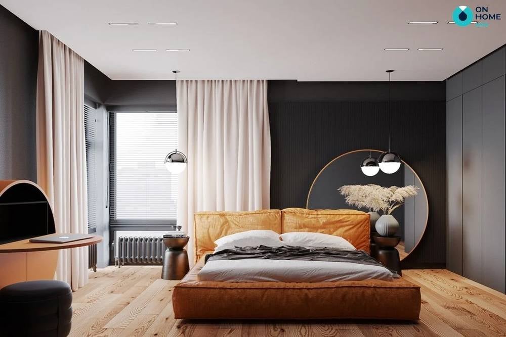 Không gian phòng ngủ sử dụng tông cam - đen làm chủ đạo.